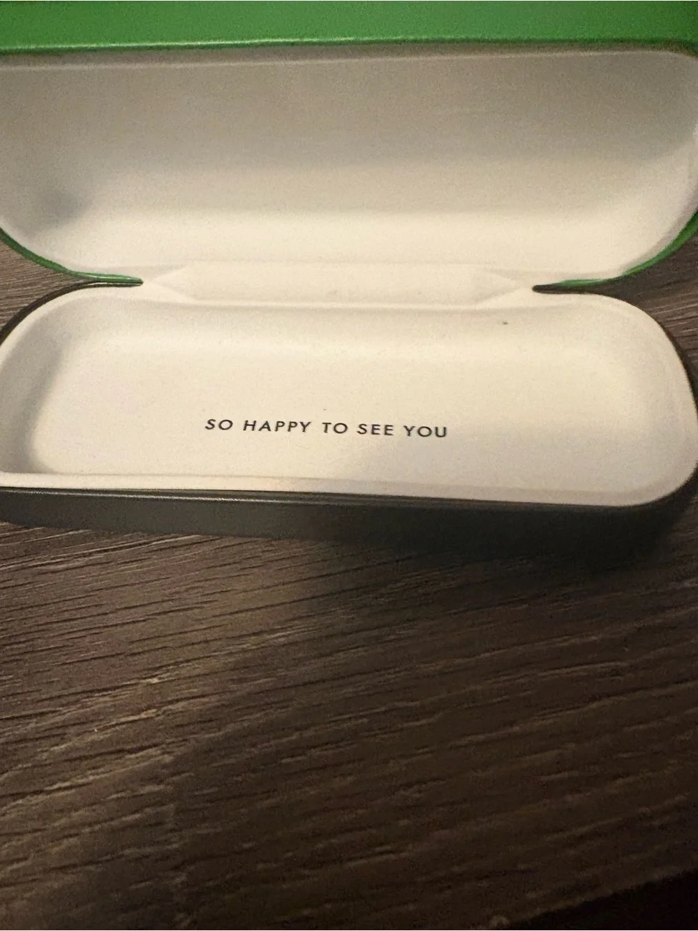kate spade Green glass case. Has flaw on front.